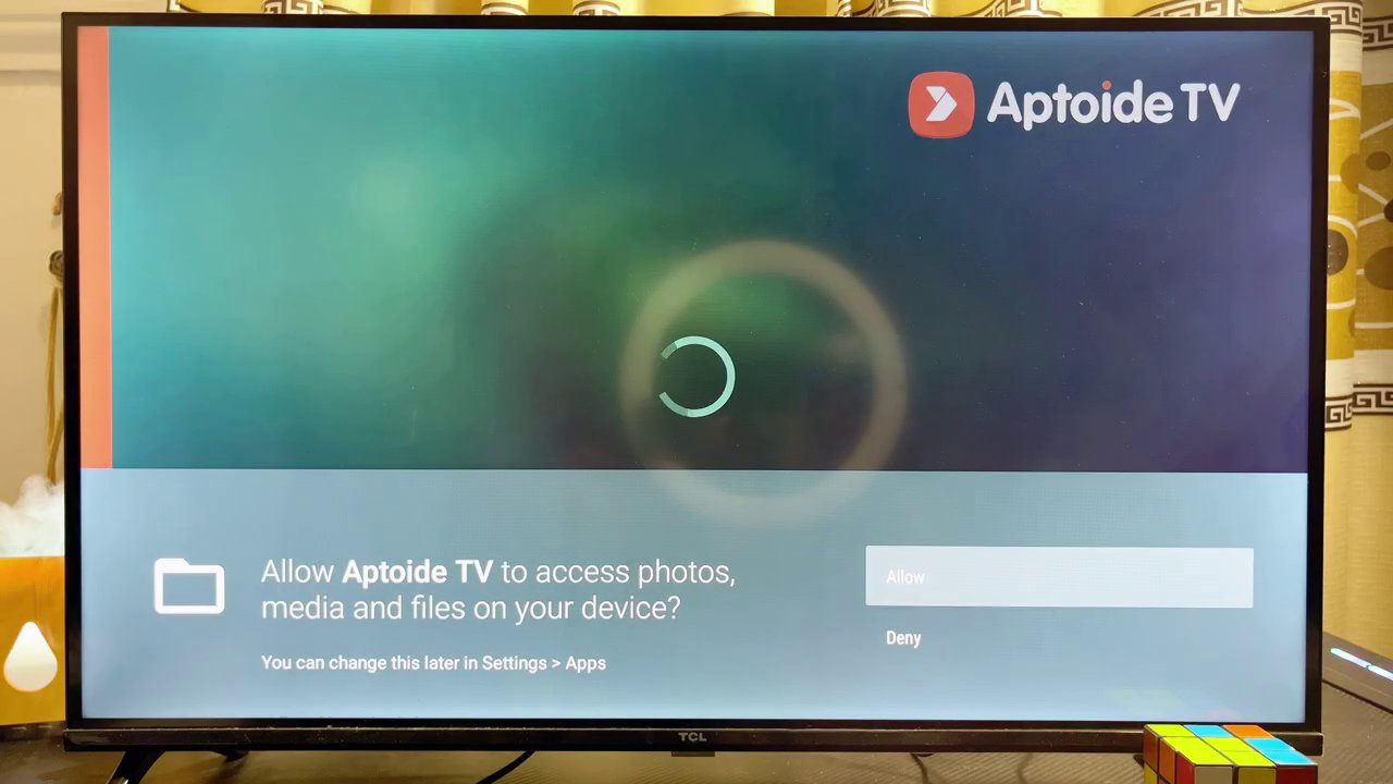 The TikTok app running on an Android TV, showing a video playing with the like, comment, and share buttons on the right side of the screen.