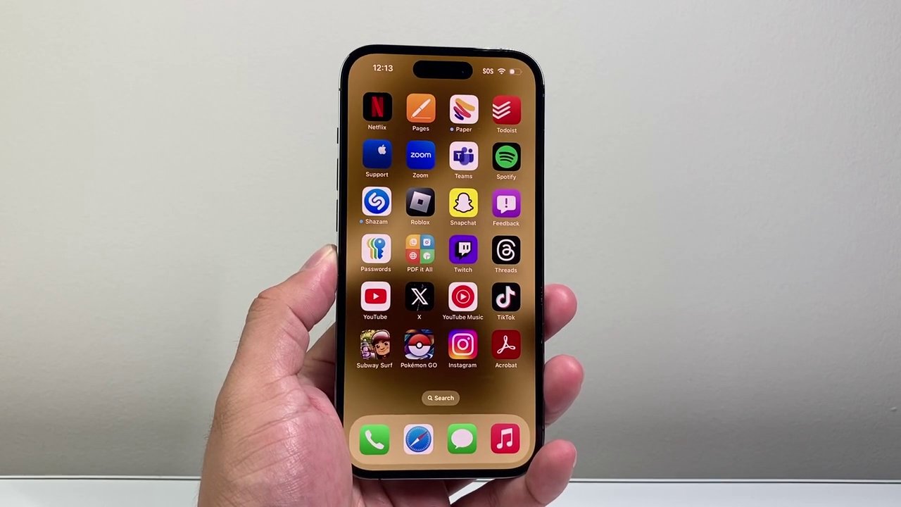 A person holding a phone, introducing the topic of downloading TikTok videos without a watermark.