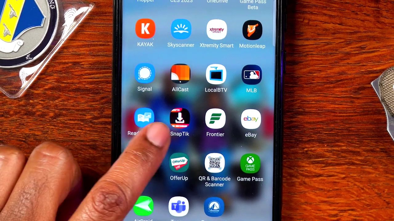 The SnapTick app interface showing a successful download notification, confirming the video has been saved without a watermark.