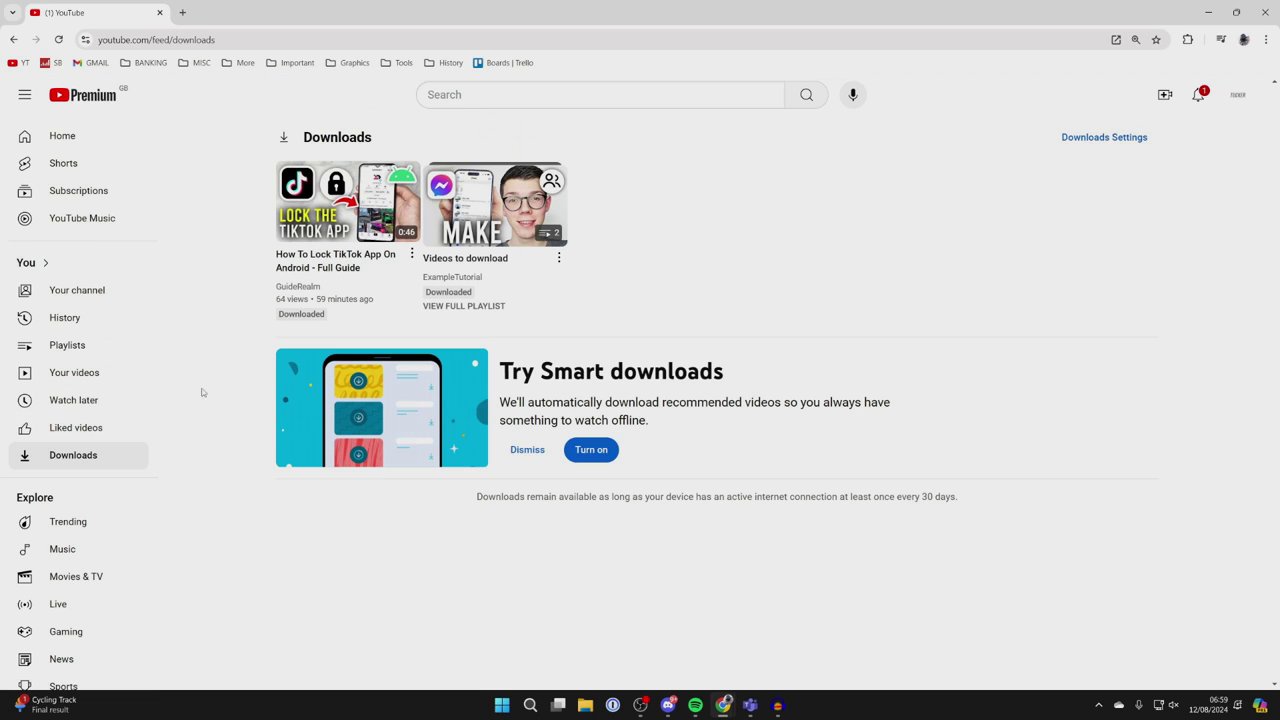 The YouTube menu panel is open, showing the 'Downloads' option highlighted, leading to the library of saved videos.